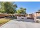 Backyard has a built-in barbecue and mature trees for shade at 17059 W Northampton Rd, Surprise, AZ 85374