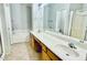 Bathroom features dual sinks, tile floors, and a separate tub and shower at 17059 W Northampton Rd, Surprise, AZ 85374