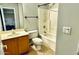 Clean bathroom features a shower-tub combo, tile flooring, and vanity at 17059 W Northampton Rd, Surprise, AZ 85374