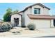 Charming two-story home with desert landscaping and a two-car garage at 17059 W Northampton Rd, Surprise, AZ 85374