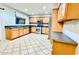 Bright kitchen with tile floors, stainless appliances, and plenty of cabinets at 17059 W Northampton Rd, Surprise, AZ 85374