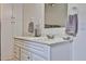 Bathroom featuring bright lighting, vanity with white cabinets, and neutral decor at 17200 W Bell Rd # 1185, Surprise, AZ 85374