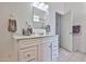 Bright bathroom with vanity, white cabinets, and tiled floor at 17200 W Bell Rd # 1185, Surprise, AZ 85374