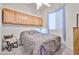 Charming bedroom with built-in cabinets, a cozy chair, and soft, neutral tones at 17200 W Bell Rd # 1185, Surprise, AZ 85374