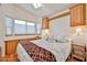 Serene bedroom featuring built-in cabinets, bright windows, and ample storage space at 17200 W Bell Rd # 1185, Surprise, AZ 85374