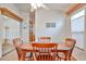 Traditional dining room featuring a wooden table set, ceiling fan and light filled window at 17200 W Bell Rd # 1185, Surprise, AZ 85374