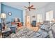 Cozy living room featuring a ceiling fan, hardwood flooring and plenty of seating at 17200 W Bell Rd # 1185, Surprise, AZ 85374