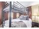 Bedroom with a metal bunk bed frame, neutral curtains, and natural light at 17200 W Bell Rd # 119, Surprise, AZ 85374