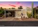 Charming single-story home featuring desert landscaping and a covered parking area, perfect for easy living at 17200 W Bell Rd # 119, Surprise, AZ 85374