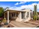 Single-story home with covered parking, well-maintained exterior, and desert landscaping, offering easy desert living at 17200 W Bell Rd # 119, Surprise, AZ 85374