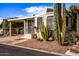 Single-story home featuring desert landscaping and a well-maintained exterior with a covered carport at 17200 W Bell Rd # 119, Surprise, AZ 85374