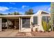 Single-story home with covered parking and desert landscaping, creating an inviting curb appeal at 17200 W Bell Rd # 119, Surprise, AZ 85374