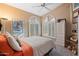 Bright bedroom with carpet, shuttered windows, ceiling fan, and neutral walls providing a relaxing atmosphere at 18932 N 89Th Way, Scottsdale, AZ 85255