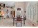 Bright dining area with glass top table and custom chair design at 18932 N 89Th Way, Scottsdale, AZ 85255