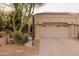 Charming home featuring desert landscaping, including saguaro and barrel cactus and a two car garage at 18932 N 89Th Way, Scottsdale, AZ 85255