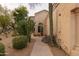 Charming home featuring desert landscaping, including saguaro and barrel cactus and a covered front entrance at 18932 N 89Th Way, Scottsdale, AZ 85255