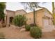 Charming home featuring desert landscaping, including saguaro and barrel cactus and decorative rock at 18932 N 89Th Way, Scottsdale, AZ 85255