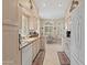 Modern kitchen featuring granite countertops, arched windows, and white appliances at 18932 N 89Th Way, Scottsdale, AZ 85255