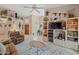 Bright living room with tile flooring, a ceiling fan, and natural light at 18932 N 89Th Way, Scottsdale, AZ 85255