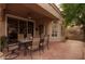 Outdoor patio features tile flooring, a ceiling fan, and comfortable seating for outdoor dining and relaxation at 18932 N 89Th Way, Scottsdale, AZ 85255