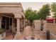 Covered patio with tile flooring features an outdoor fireplace and comfortable seating for outdoor enjoyment at 18932 N 89Th Way, Scottsdale, AZ 85255