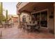 Relaxing patio features a grill and seating under a stucco porch, perfect for enjoying the Arizona sunshine at 18932 N 89Th Way, Scottsdale, AZ 85255