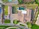 Expansive aerial view of the property showcasing the pool, lush landscaping, and large lot at 20216 E Sunset Ct, Queen Creek, AZ 85142