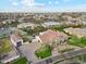 Aerial view showcasing the home, garage, pool, and well-manicured landscaping at 20216 E Sunset Ct, Queen Creek, AZ 85142