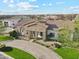 Aerial view of a lovely home showcasing a circular driveway and lush landscaping at 20216 E Sunset Ct, Queen Creek, AZ 85142