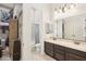 Bathroom featuring double sink, tile floor and shower/bath tub combination at 20216 E Sunset Ct, Queen Creek, AZ 85142