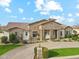 Attractive single-story home with manicured landscaping and a paved driveway at 20216 E Sunset Ct, Queen Creek, AZ 85142