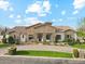 Stunning exterior of a single-story home with stone accents and a circular driveway at 20216 E Sunset Ct, Queen Creek, AZ 85142