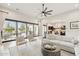 Bright and spacious living room seamlessly connects to outdoor areas and showcases modern design elements at 20216 E Sunset Ct, Queen Creek, AZ 85142