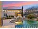 Beautiful pool area with lounge chairs, umbrella, and string lights for evening relaxation at 20216 E Sunset Ct, Queen Creek, AZ 85142