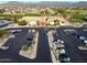 Aerial image showcasing the community clubhouse, parking lot, and surrounding neighborhood at 22569 W Lasso Ln, Buckeye, AZ 85326