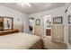 Inviting bedroom with an ensuite bathroom and neutral decor, and closet, and ceiling fan at 22569 W Lasso Ln, Buckeye, AZ 85326