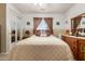 Bright bedroom featuring window, ceiling fan, and neutral tones providing a serene atmosphere at 22569 W Lasso Ln, Buckeye, AZ 85326