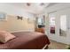 Cozy bedroom featuring neutral-toned walls, a comfy bed, and a mirrored closet at 22569 W Lasso Ln, Buckeye, AZ 85326