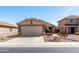 Charming single story home with desert landscaping, an attached two car garage and covered front porch at 22569 W Lasso Ln, Buckeye, AZ 85326