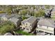 Aerial shot of a residential home with manicured lawn and back patio situated amongst a lush landscape at 2331 E Pecan Rd, Phoenix, AZ 85040