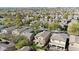 Extensive aerial shot of a suburban neighborhood with many homes and mature trees lining the streets at 2331 E Pecan Rd, Phoenix, AZ 85040