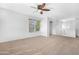 Bright bonus room featuring carpet flooring, a ceiling fan, and a serene atmosphere for relaxation at 2331 E Pecan Rd, Phoenix, AZ 85040