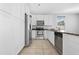 Kitchen with white cabinets, stainless appliances, and granite countertop with tile floor at 2331 E Pecan Rd, Phoenix, AZ 85040