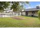 Expansive backyard featuring a sparkling pool, covered patio, and mature orange trees at 2440 E Hale St, Mesa, AZ 85213