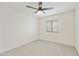 This bedroom features neutral paint, carpet and a modern ceiling fan with light fixture at 2440 E Hale St, Mesa, AZ 85213