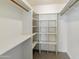 Walk-in closet with custom shelving and clothing racks at 2440 E Hale St, Mesa, AZ 85213