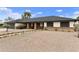 Charming single-story home featuring a gravel front yard, brick accents and a welcoming entrance at 2440 E Hale St, Mesa, AZ 85213