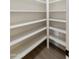 Walk-in pantry with floor-to-ceiling shelving to maximize storage at 2440 E Hale St, Mesa, AZ 85213