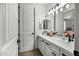 Bright bathroom features double sinks, granite counters, and contemporary lighting at 2484 E Lodgepole Dr, Gilbert, AZ 85298