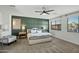 This bedroom features a decorative accent wall and large windows at 2484 E Lodgepole Dr, Gilbert, AZ 85298